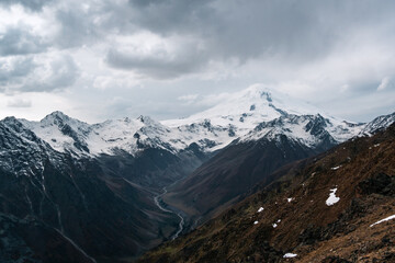 Wall Mural - View of the valley and Mount Elbrus in the cloud