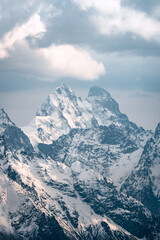 Wall Mural - View of  Mount Ushba and snow-covered peaks on a cloudy day