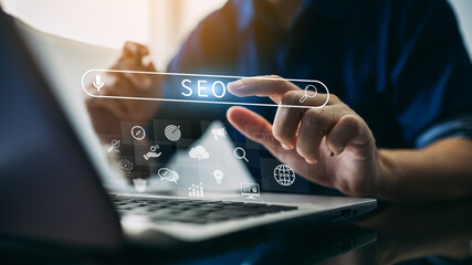 Wall Mural - person working with tcomputer laptop for manage search engine optimization : seo with social media c