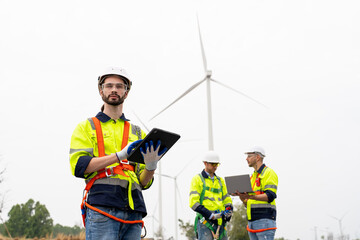 Wall Mural - Wind turbine service engineer maintenance and plan for inspection at construction site, renewable electricity generator.