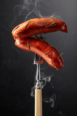 Wall Mural - Roasted Bavarian sausages with rosemary.