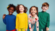 © Syntetic Dreams - A group of  cheerful multiethnic children hugging, posing smiling kids of different skin tones and nationalities, on blue background