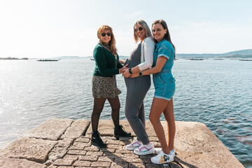 Pregnant woman with her mother and sister