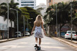 © Dantaz - Skateboarder girl on the urban landscape. Generative AI