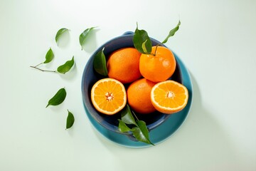 Wall Mural - Closeup shot of appetizing oranges on the table, perfect for backgrounds