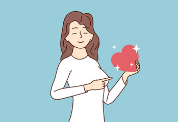 A happy girl holds a heart in her hands and points her finger at it. Donation or charity concept with woman. The girl smiles and is in love. Vector illustration