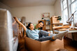 © Drazen - Carefree women have fun after moving into new apartment.