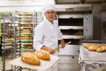 Wall Mural - Usual work of baker in a bakery