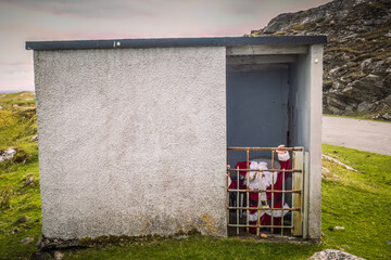 Wall Mural - Bus stop with father christmas in  near to Flodbay on the Isle of Harris