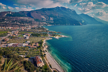 Panorama of Torbole a small town on Lake Garda, Italy. Europa.Beautiful Lake Garda surrounded by mountains  in the spring time seen from Mount Brione