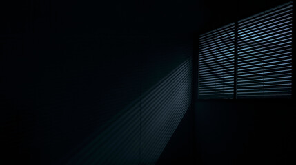 interior of dark blue room. shadow of the rays falling on the wall through the louvers. Light from the lamp and shadow on room wall from roller window shutter. night club. black and blue