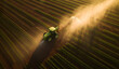 Aerial shot of a tractor sprayed with water in a field at sunset, near green crops, in the style of australian tonalism, Generative Ai