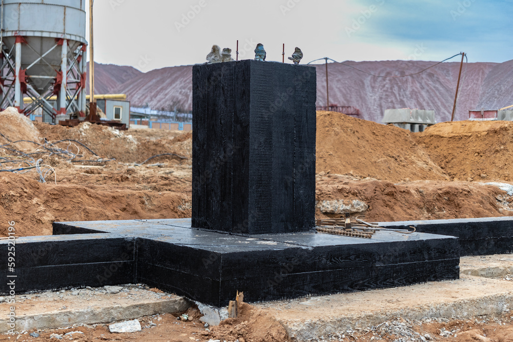 Monolithic reinforced concrete foundation waterproofed with bituminous ...