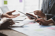 © PHOTO4U - Atmosphere of a startup company meeting, business people are meeting together to summarize and plan investment finances, they are the founders of the company. Business administration concept.