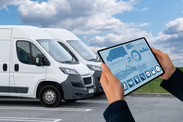 Aufkleber - Manager with a digital tablet on the background of vans. Fleet management
