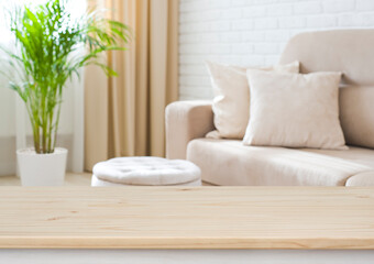 Wall Mural - empty wooden table top on blurred living room interior background
