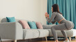© shevtsovy - Athletic woman sports workout at home. Home workout. Slim female wearing sports wear stretching at home and weight loss workout in a living room.