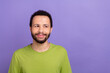 © deagreez - Portrait of positive minded creative man look interested empty space contemplate isolated on purple color background