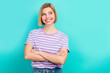© deagreez - Portrait of optimistic good mood woman short haircut wear stylish t-shirt look empty space arms folded isolated on teal color background