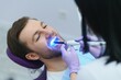 © Serhii - Young man at the dentist. Dental care, taking care of teeth. Picture with copy space for background.