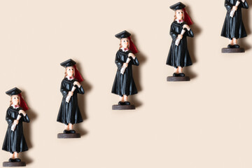 Wall Mural - Class of 2023 concept. Wooden number 2023 with graduate statuette on color background