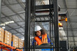 © FotoArtist - Female forklift driver working in a warehouse.