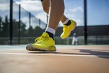 Fototapeta Sport - Detail of men's sports shoes playing on tennis court. Generative ai