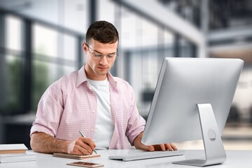 Poster - young business male working on computer