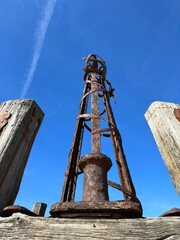 Wall Mural - Looking up at the iron towers of St Anne's pier in Lytham Lancashire with a blue sky background. 