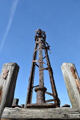 Wall Mural - Looking up at the iron towers of St Anne's pier in Lytham Lancashire with a blue sky background. 