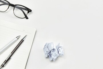 Sticker - Office desktop with notebook, glasses, and pens with copy space