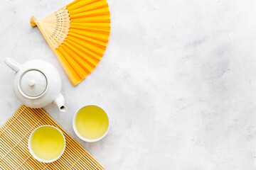 Wall Mural - Japanese table setting with teapot and cups of tea