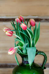 Canvas Print - Bouquet of pink and yellow tulips in vintage ceramic vase.