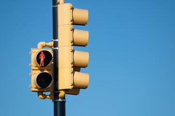 Sticker - Red light for the pedestrian on the blue background of the sky