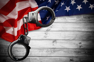 police handcuffs on the usa flag, close-up