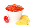 Bowl of delicious salsa sauce, nachos and pepper isolated on white background