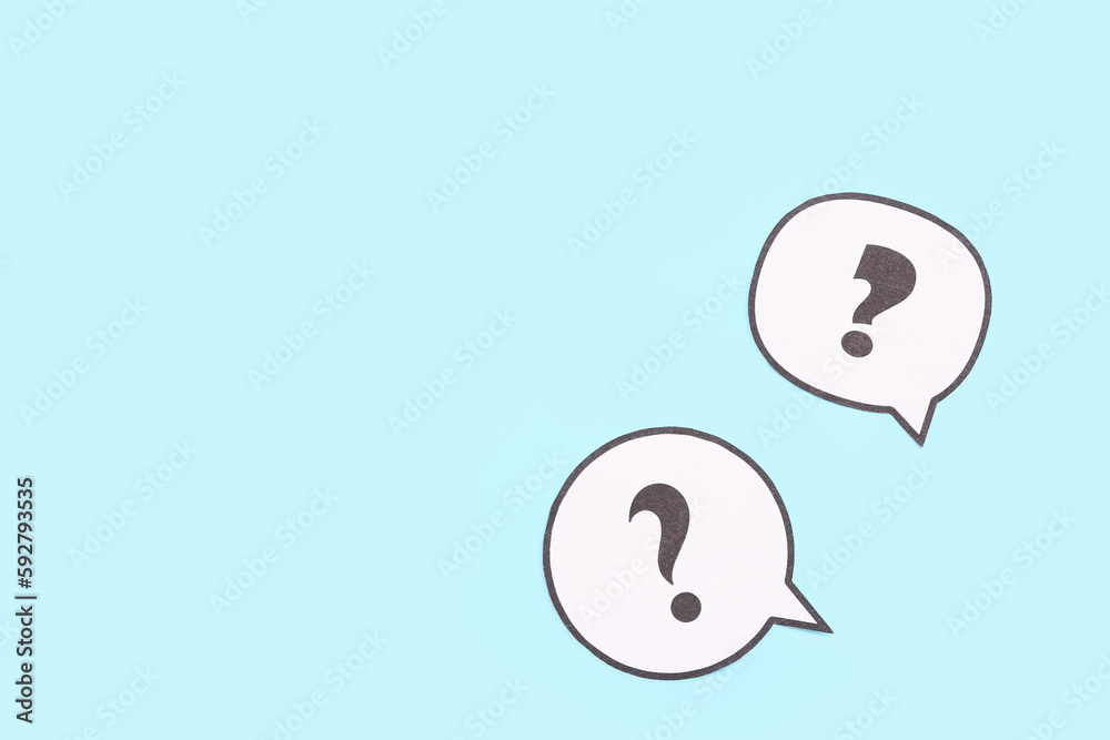 Speech bubbles with question marks on blue background