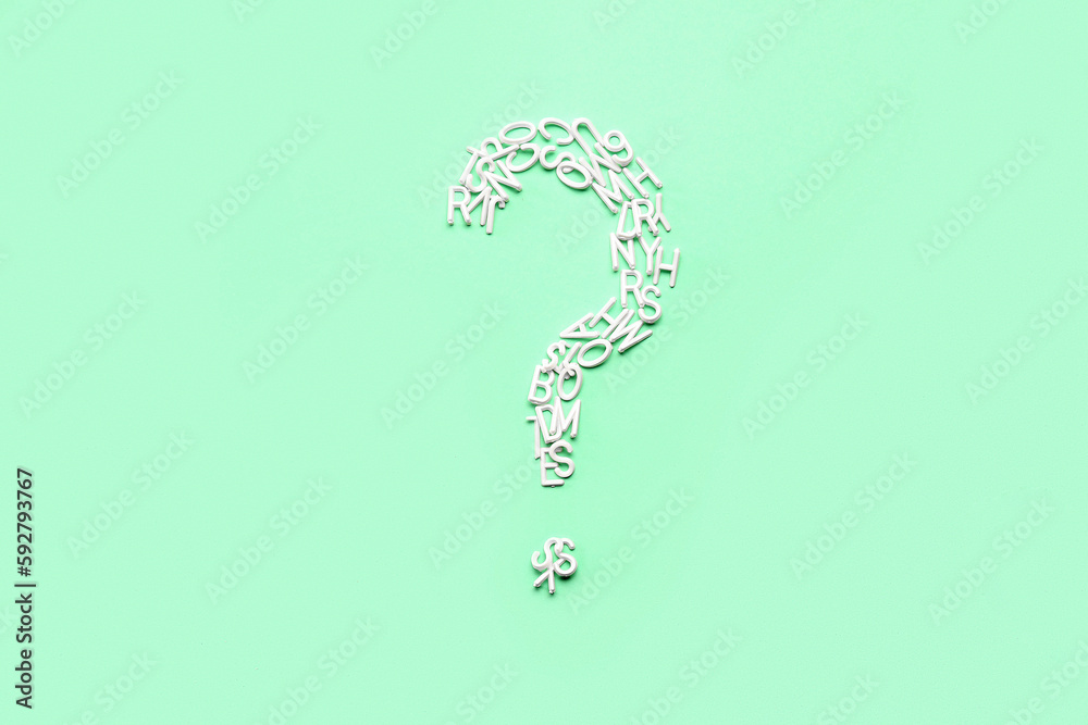Question mark made of letters on green background