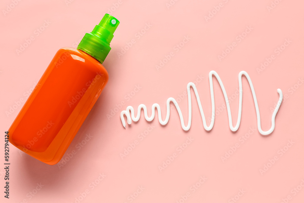Sunscreen cream on pink background