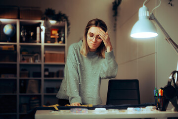 Worried Dressmaker Feeling Overwhelmed with Work. Fashion designer feeling upset making mistakes forgetting about deadline
