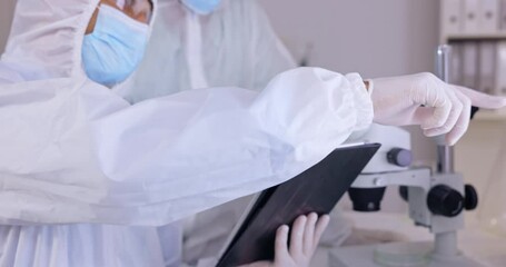 Poster - Tablet, medical research and people in a lab, hazmat and discussion for experiment, planning or update results. Scientists, researchers or employees with a device, technology or healthcare innovation