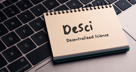 Poster - There is note book with the word DeSci（Decentralized Science） on a laptop. It is an eye-catching image.