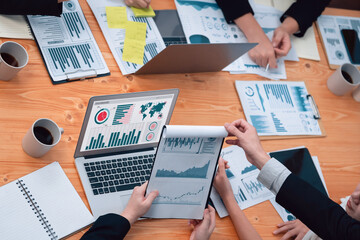 Poster - Top-view closeup business team of financial data analysis meeting with business intelligence, report paper and dashboard on laptop. Business group people working together in harmony office.