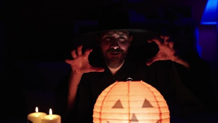 Poster - Young bald man wearing wizard costume doing magic gesture at home