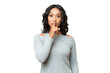 © luismolinero - Young Argentinian woman over isolated background showing a sign of silence gesture putting finger in mouth