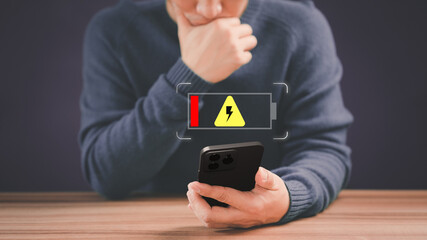 Poster - Man was angry and frustrated when he realized that his smartphone ran out of battery while playing social media and he didn't power bank or bring a charging adapter. Mobile phone battery no power.