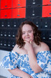 © Austockphoto - community access for person with a disability - teen with down syndrome sitting by post office boxes