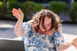 © Austockphoto - Happy seventeen year old girl with a disability doing a joyful dance move