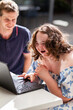 © Austockphoto - Young person who has down syndrome working with her disability worker NDIS provider on laptop