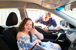 © Austockphoto - Teenager with down syndrome sitting in car with seatbelt on in passenger seat
